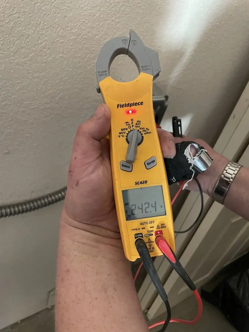 Voltage testing with clamp meter during Outlet Installation in Boxford